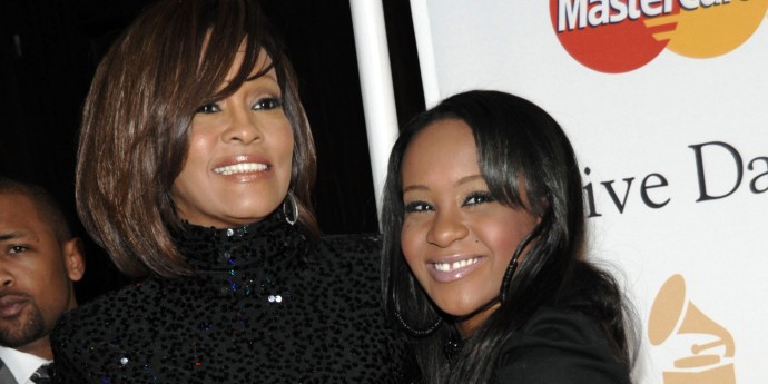 FILE - In this Feb. 12, 2011 file photo, singer Whitney Houston, left, and her daughter Bobbi Kristina arrive at the Pre-Grammy Gala & Salute to Industry Icons with Clive Davis honoring David Geffen in Beverly Hills, Calif. Bobbi Kristina Brown has been spotted wearing a sparkly bauble on her ring finger, but she's not planning on getting married anytime soon. A rep for Brown's mother, the late Whitney Houston, says the 19-year-old is simply wearing her mother's ring and that she's not engaged. (AP Photo/Dan Steinberg, file)