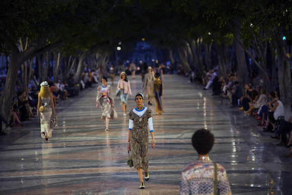 Models wear creations from the Karl Lagerfeld "cruise" line for fashion house Chanel, at the Paseo del Prado street in Havana, Cuba, Tuesday, May 3, 2016. With the heart of the Cuban capital effectively privatized by an international corporation under the watchful eye of the Cuban state, the premiere of Chanel 2016/2017 "cruise" line offered a startling sight in a country officially dedicated to social equality and the rejection of material wealth. (AP Photo/Ramon Espinosa)