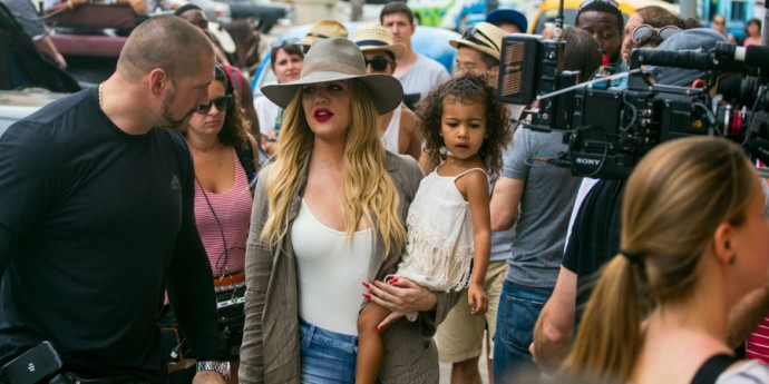 American entrepreneur and television personality Khloe Kardashian Odom holds a child, as she prepares to enter the Havana Club Rum Museum in Havana, Cuba, Wednesday, May 4, 2016. Khloe and the rest of the Kardashian clan are some of the famous entertainment figures to visit the island, since the declaration of detente with the U.S. in December 2014. (AP Photo/Desmond Boylan) Cuba Kardashians